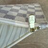 Close up of the LV stamped zip pull and the gold zip