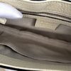 Interior pockets set into the beige lining