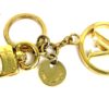 Charm laid flat showing the clasp, chain and LV circle