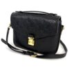Front of the bag with the leather strap laid out