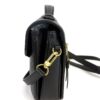Side profile with the strap clipped to the gold ring