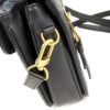 Angled side view with the strap hanging