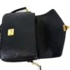 Bag with the flap open showing the front pocket