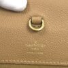 Louis Vuitton stamped on the beige leather beside the D ring