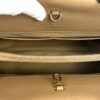 Interior zip pocket and D ring shown by a gloved hand
