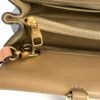 Interior opened showing the zip pocket and gold clip