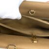Interior pocket opened by a gloved hand showing the zip