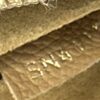 Close up of the gold stamp inside the leather pocket