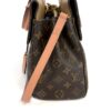 Side view with the shoulder strap hanging down
