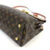 Base corner showing the gold foot and monogram canvas