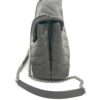 Side of the bag with the chain and leather strap
