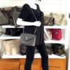 Loulou bag carried by a mannequin in the boutique