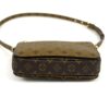 Base of the bag with the strap arching above