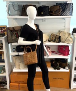 Mini Toni shopper carried by a mannequin in the boutique