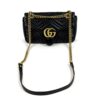 Front of the bag with the chain and leather strap