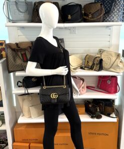 Marmont shoulder bag worn by a mannequin in the boutique