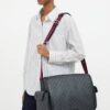 Messenger worn crossbody by a model, shown for scale
