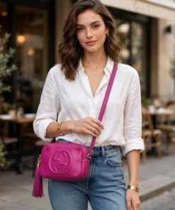 Styling image showing the Soho Disco worn crossbody with jeans