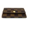 Low angle showing the flap and the gold press stud