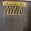 Interior close up of the six gold key hooks on their plate