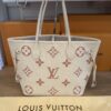 Tote resting on the original Louis Vuitton dust bag