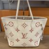 Front of the tote with both leather handles standing
