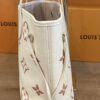 Narrow side view showing the depth of the tote