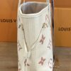Side of the tote showing the leather side lacing