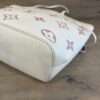 Side of the tote with the rose monogram print