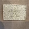 Leather tag reading LOUIS VUITTON PARIS made in France