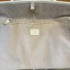 Interior zip pocket laid flat against the lining