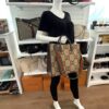 Jumbo GG tote carried by a mannequin in the boutique