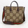 Gucci Monogram Jumbo GG Textured Dollar Calfskin Web Tote Bag Camel Ebony New Acero, shown from the front with the web strap
