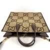 Top of the tote with the handles standing