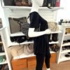 Saddle bag worn crossbody by a mannequin in the boutique