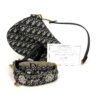 Saddle bag shown with its certificate and embellished strap