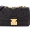 Bag standing with the chain strap draped
