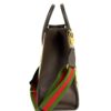 Side of the tote showing the leather gusset and web