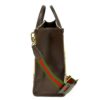 Side view with the web strap hanging beside the tote