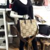 Jumbo GG tote carried by a mannequin in the boutique