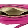 Bag held open showing the beige interior lining