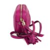 Angled view with the tassel hanging from the zip