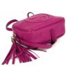 Angled view of the bag with the tassel to the side