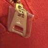 Gold zip pull embossed LV inside the tote