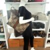 Ophidia tote carried by a mannequin in the boutique
