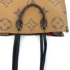 Caramel side with both handles and straps hanging