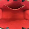 Interior showing the red lining and zip pocket