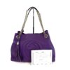Bag shown with its authenticity and information card