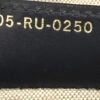 Date code 05-RU-0250 stamped on the leather trim