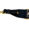 Oblique shoulder strap with its gold clip